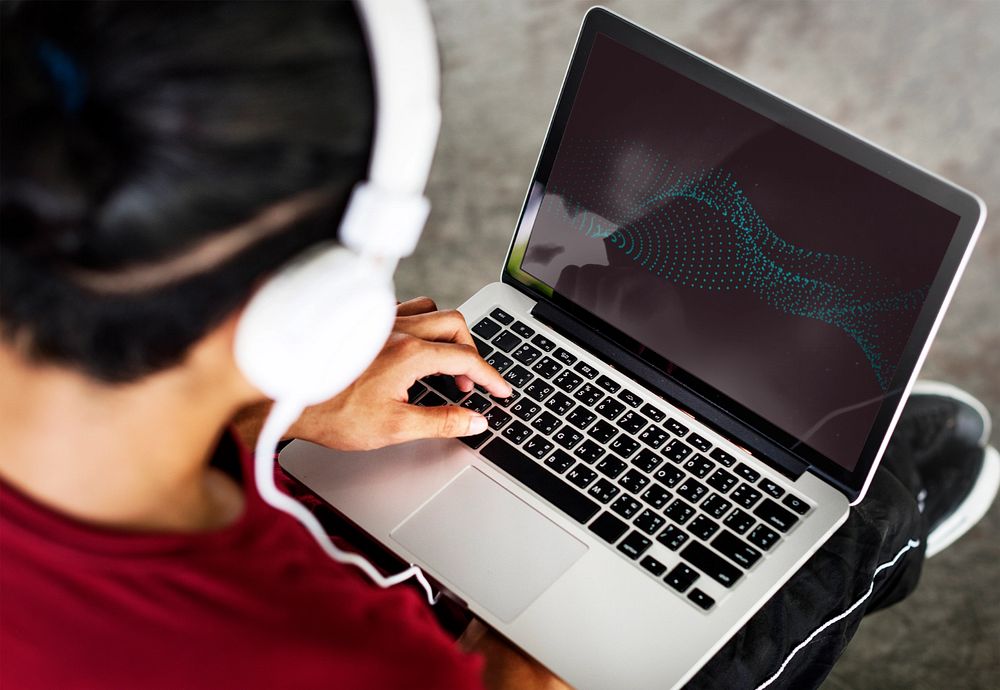 Laptop mockup, man wearing headphones 