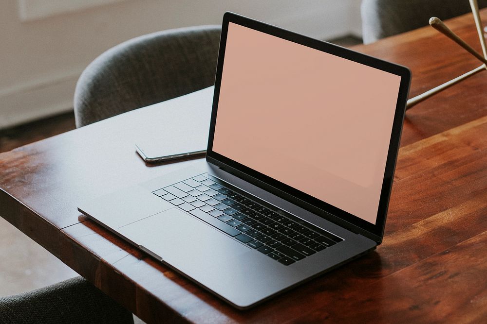 Laptop mockup, wooden table in meeting room 