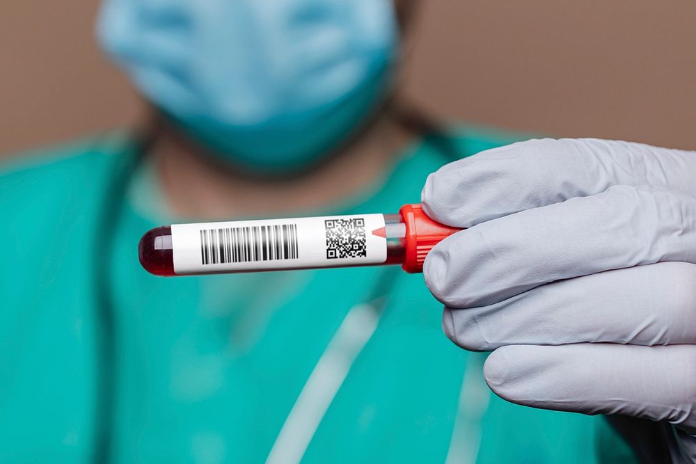 Blood test tube mockup, doctor hand