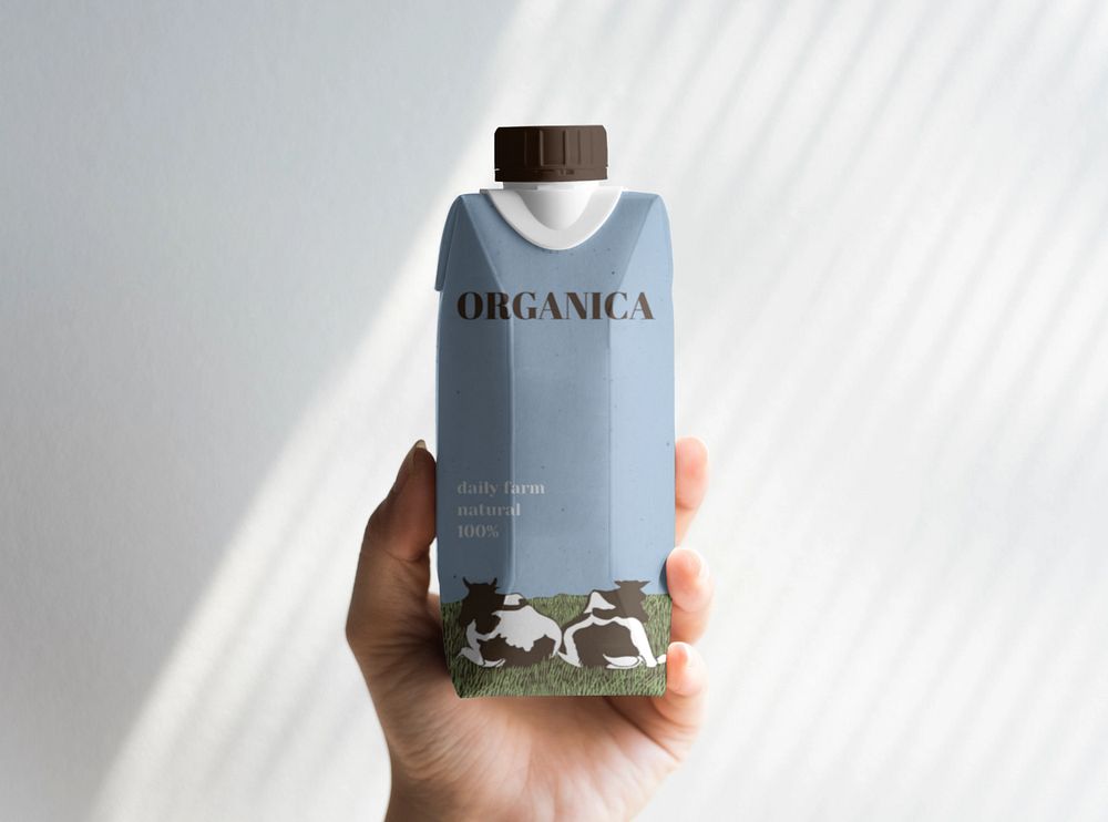 Paper bottle mockup in woman's hand, drink label design 
