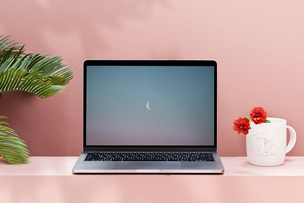 Laptop mockup, pink wall workspace 