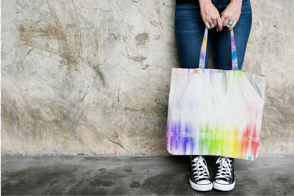 Woman holding tote bag mockup 