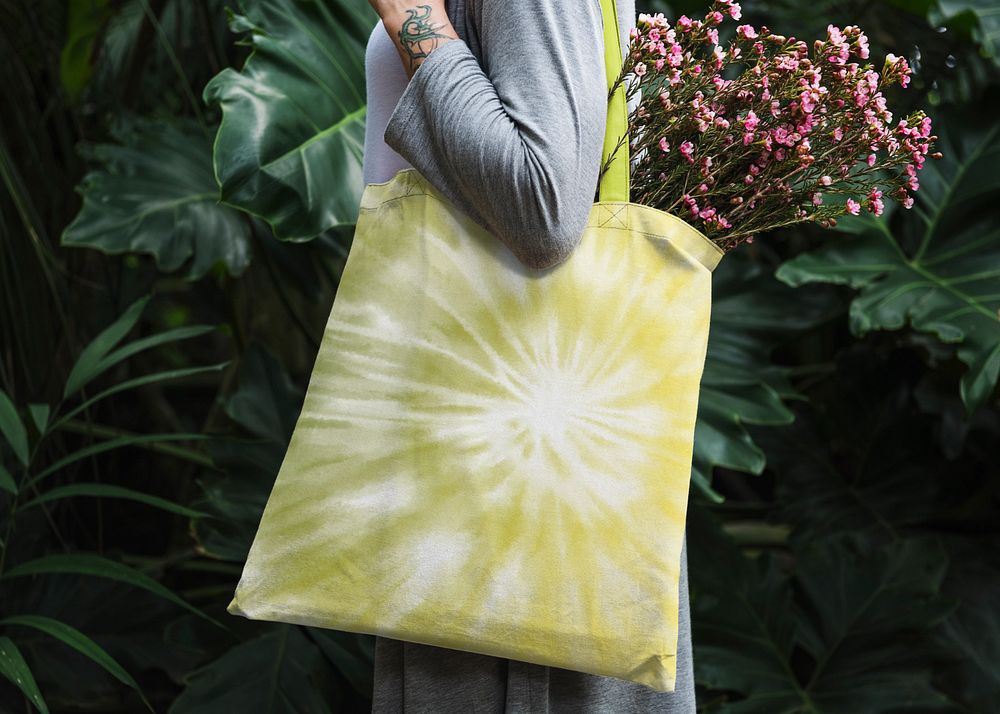 Woman holding tote bag mockup