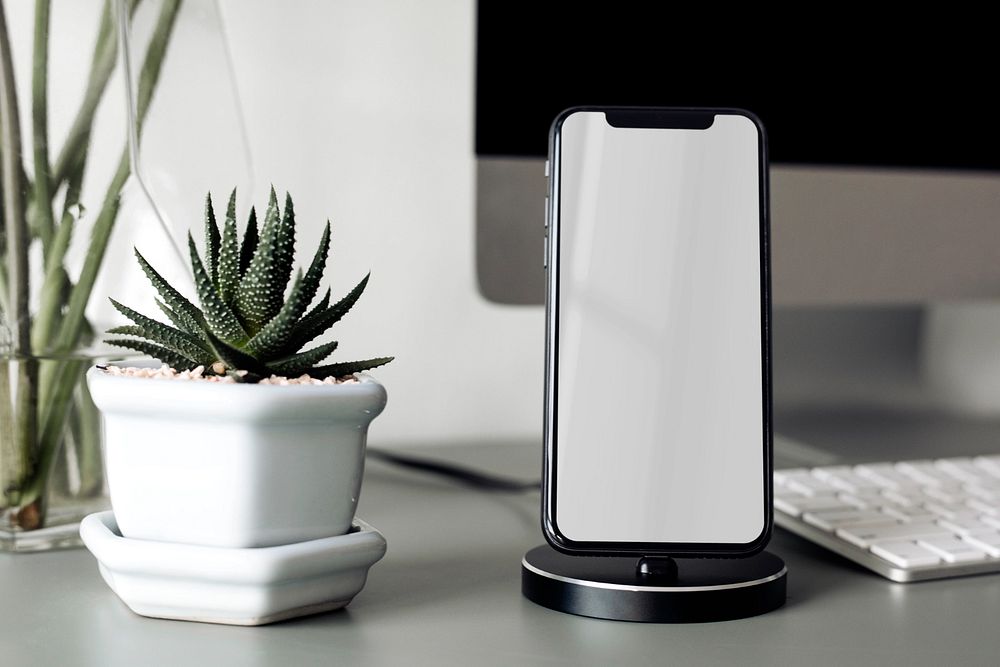 Smartphone screen mockup, desk setup, editable design