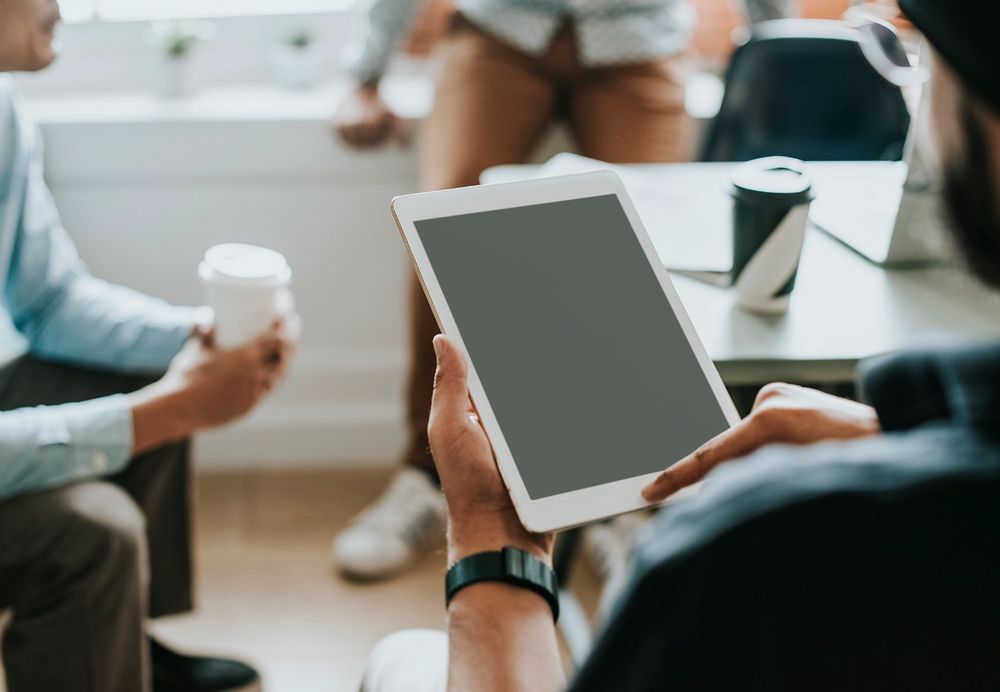 Tablet screen mockup, business people in meeting