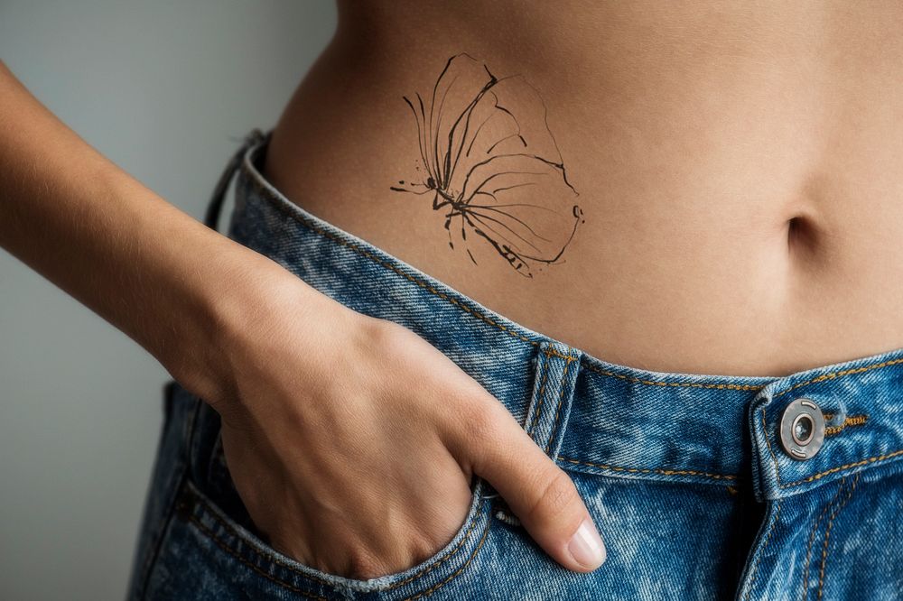 Editable tattoo mockup, woman's belly design