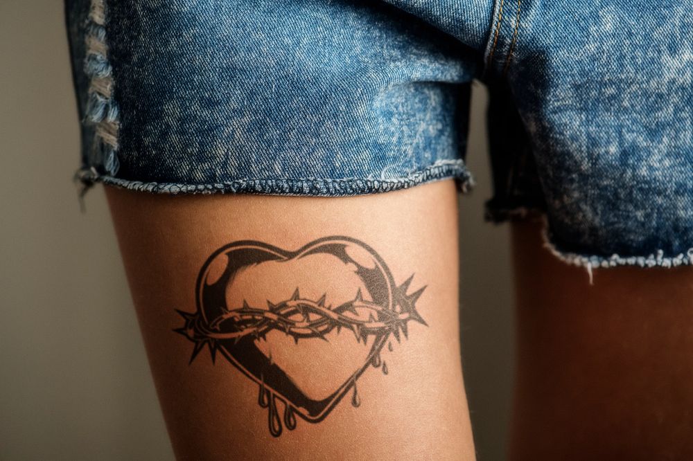 Tattoo mockup, editable woman's thigh design