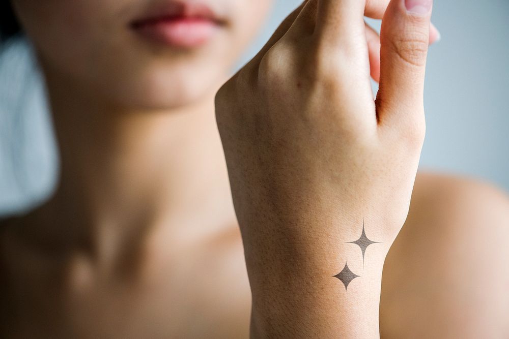 Wrist tattoo mockup, editable sparkle design