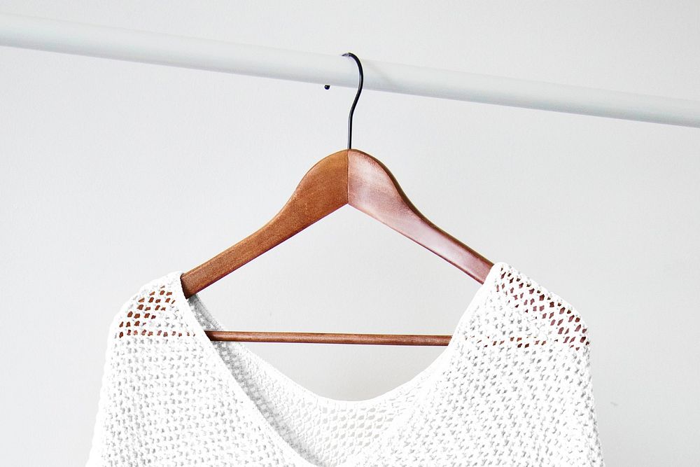 Knitted poncho editable mockup, wooden hanger