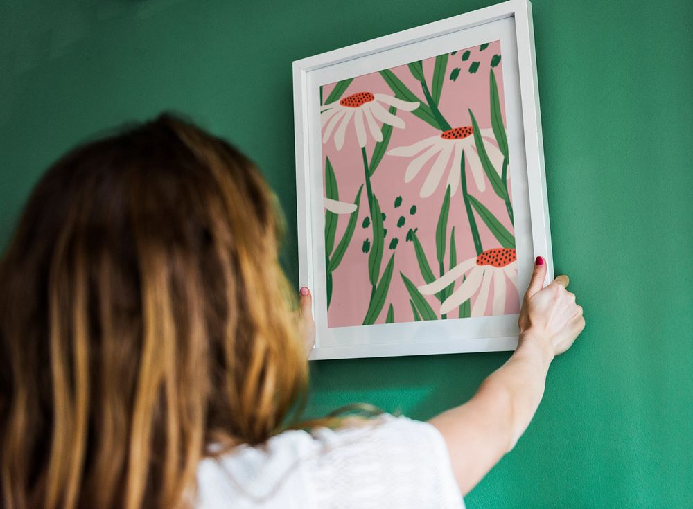 Photo frame mockup, woman decorating wall