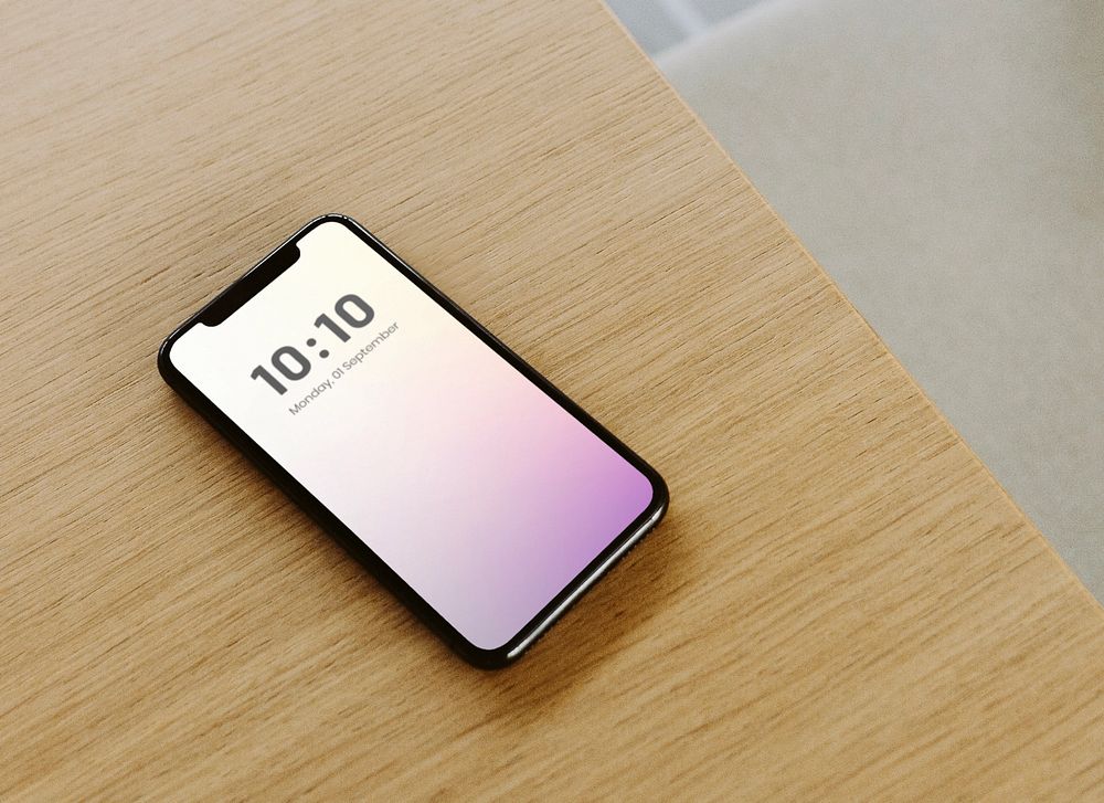 Phone mockup on wooden table