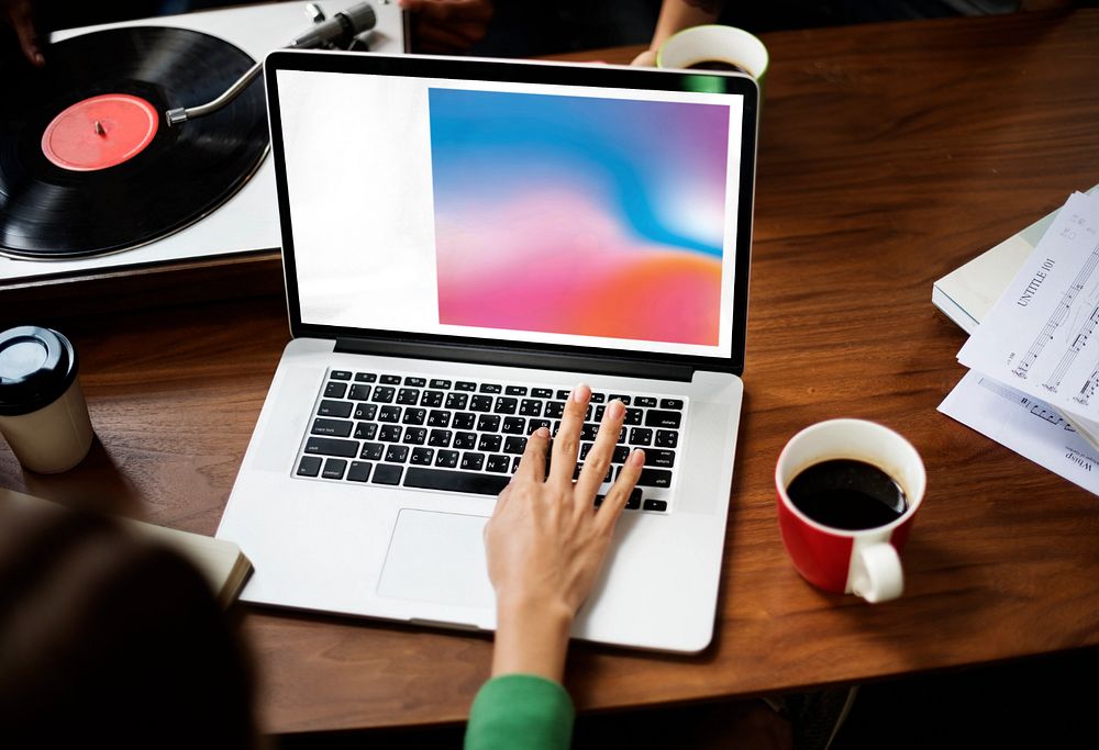 Musician using laptop mockup, editable screen