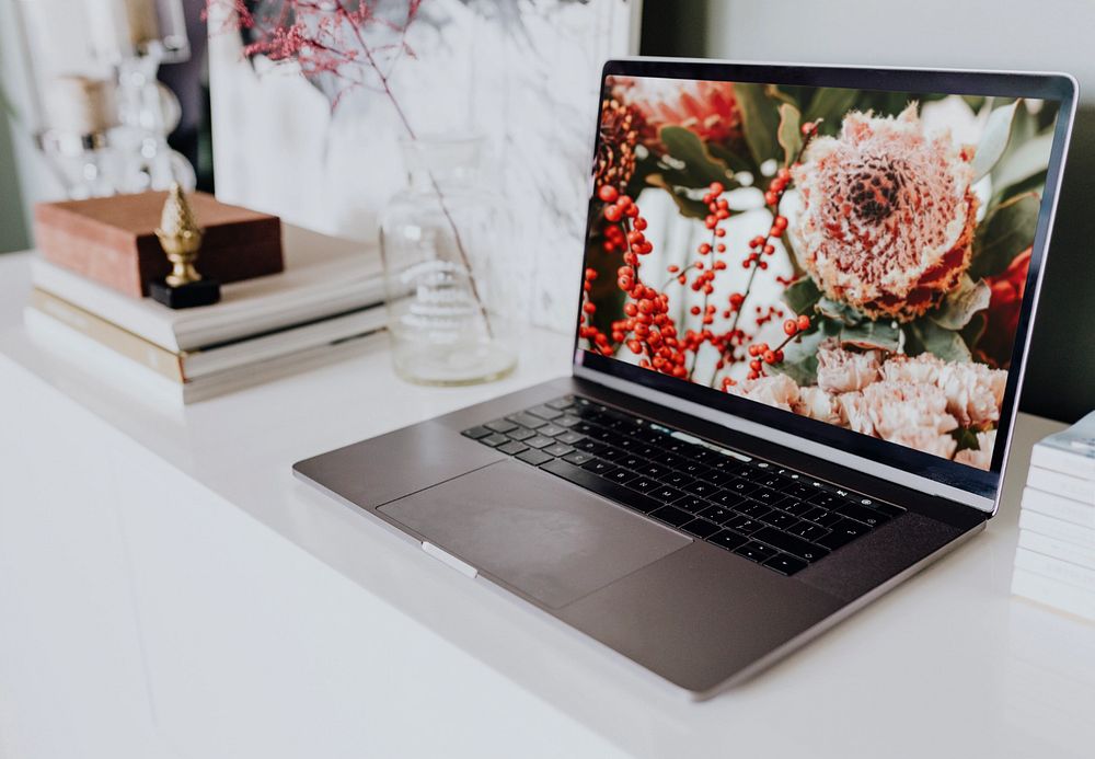 Floral laptop mockup, customizable notebook screen