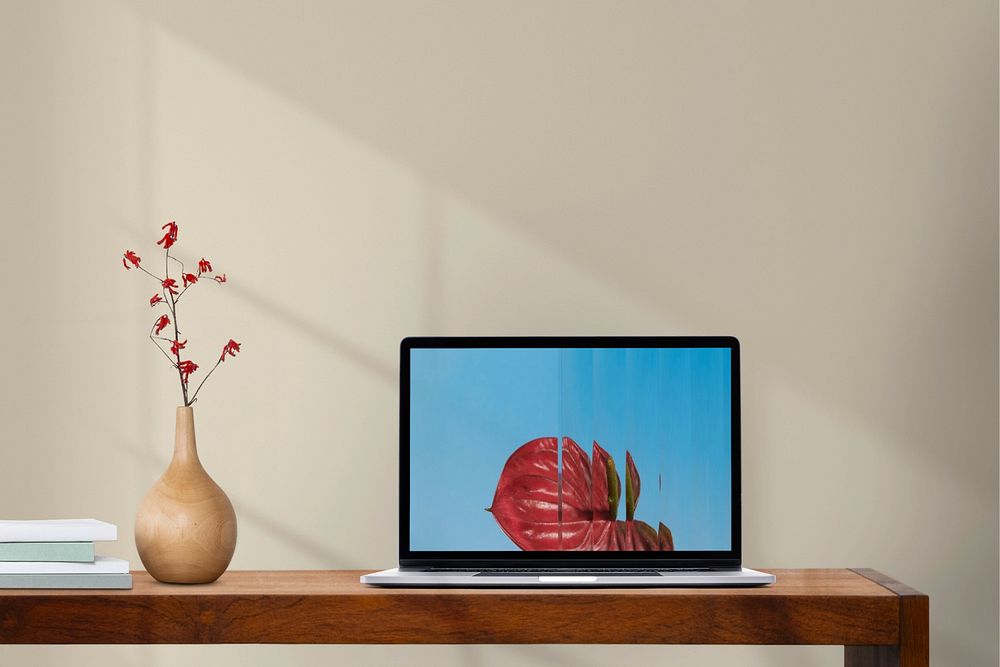 Laptop mockup on table, customizable notebook screen