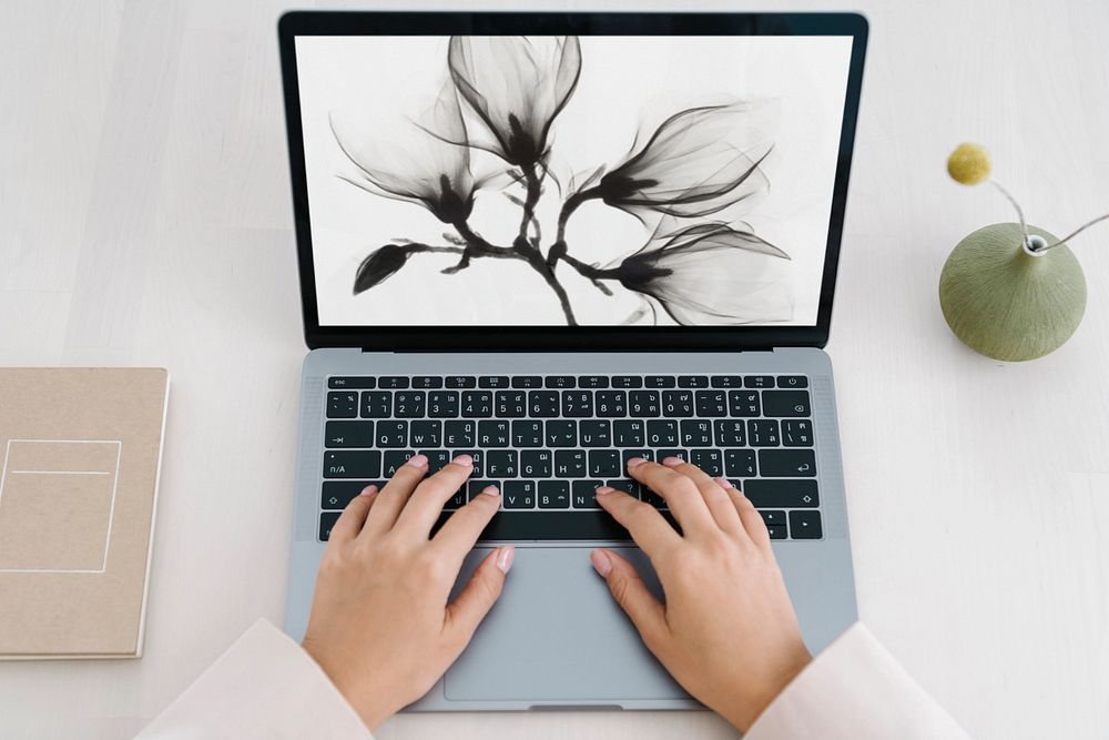 Woman using laptop mockup, editable screen