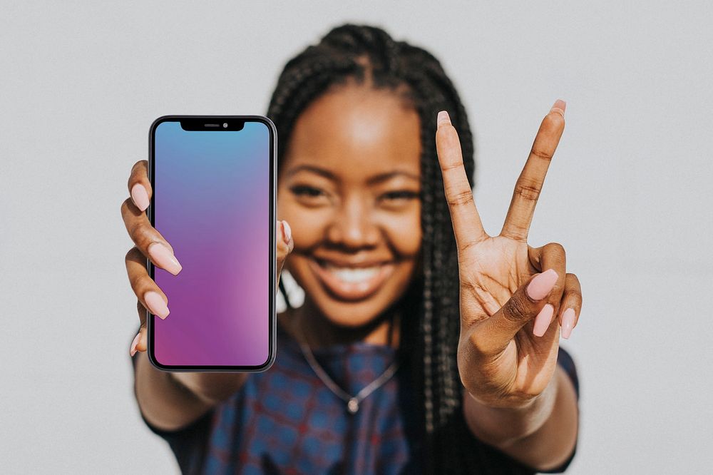 Editable phone screen mockup, held by happy woman