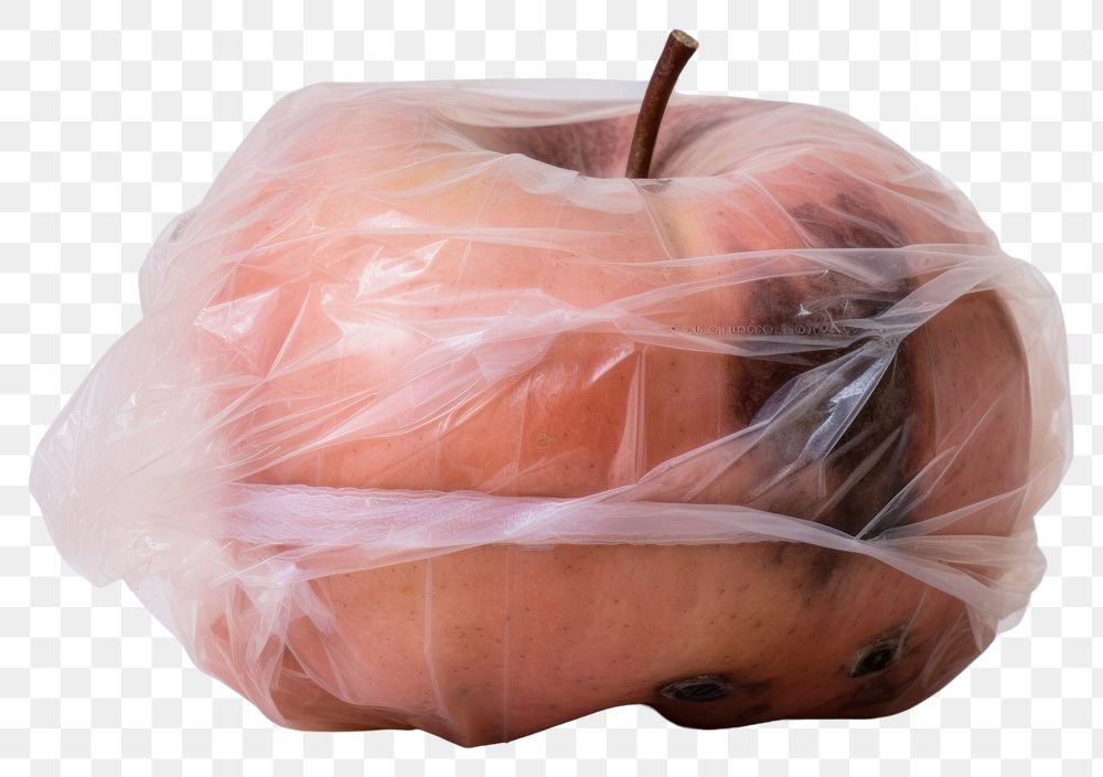 PNG  Plastic wrapping over a rotten apple plant food white background.