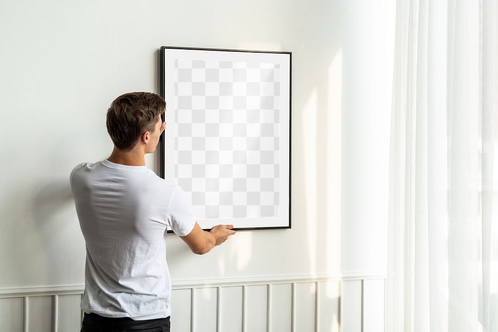 Picture frame png mockup, man decorating wall, transparent design