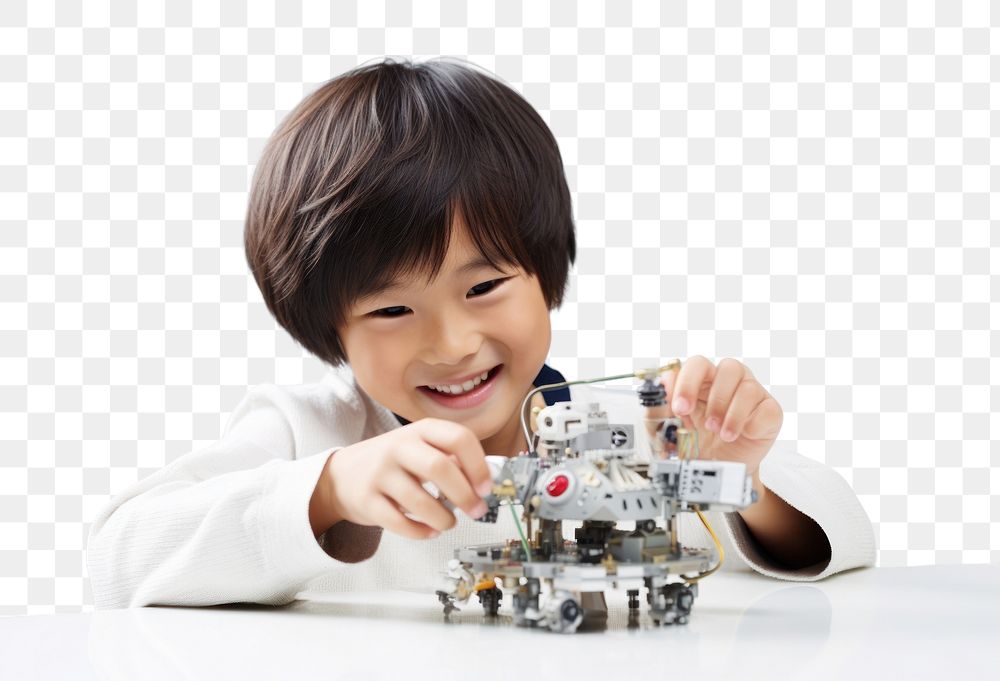 PNG Asian cute boy smiling joyfully building a robot child smile happy. AI generated Image by rawpixel.