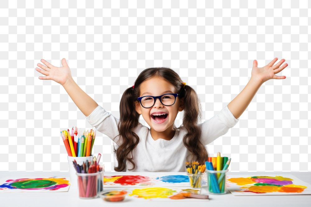 PNG Little girl sitting at a table with stationery and paint child joy paintbrush. 