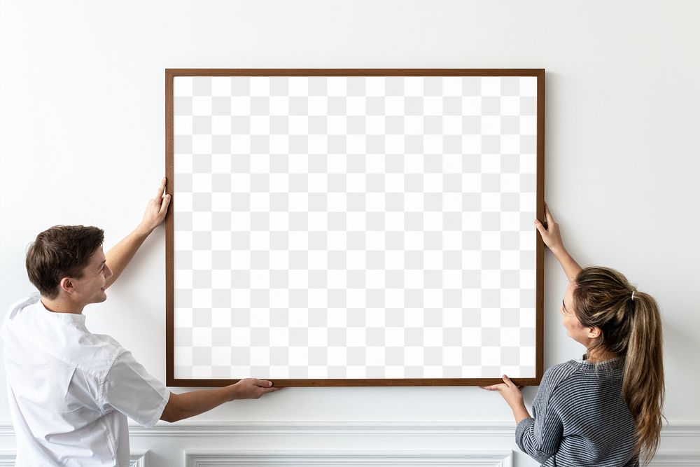 Frame mockup transparent png being hung by a couple in their new home