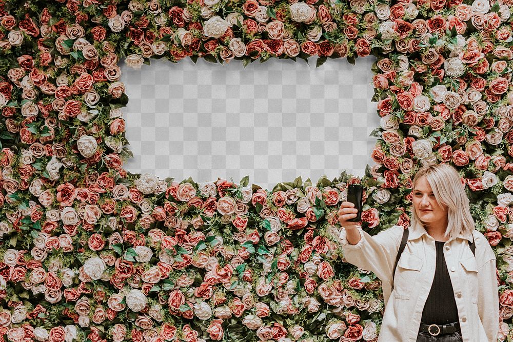 Sign mockup png with a woman taking a selfie by the flower wall installation