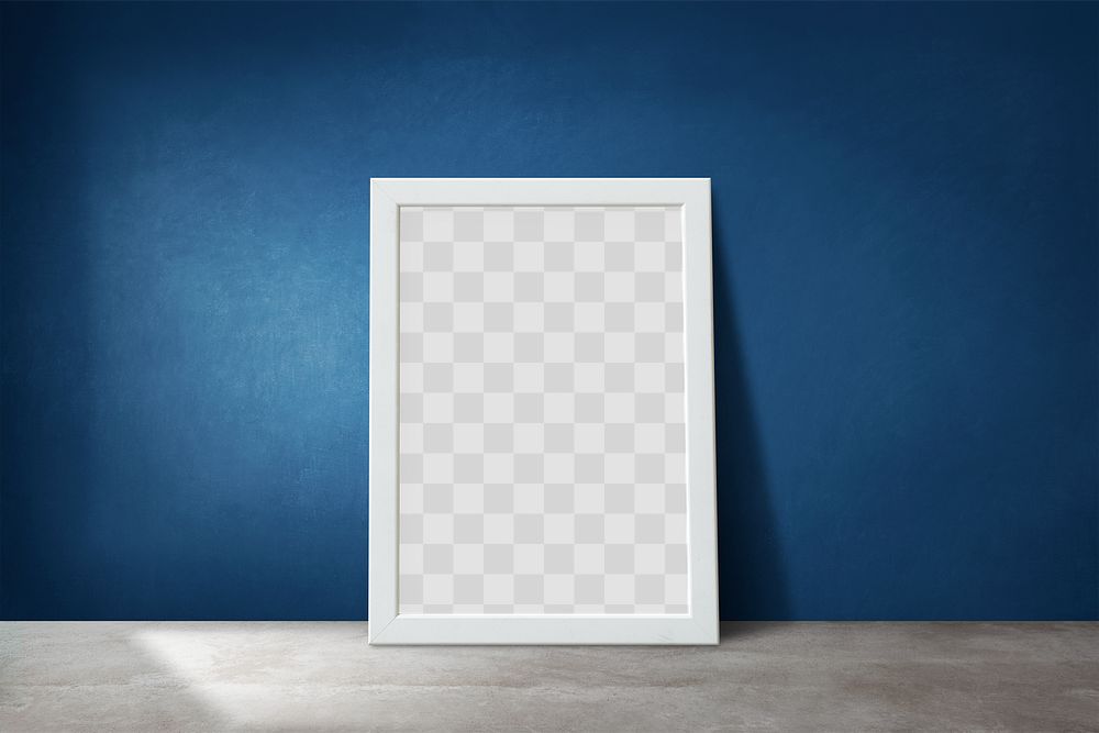 White picture frame mockup leaning against a blue wall