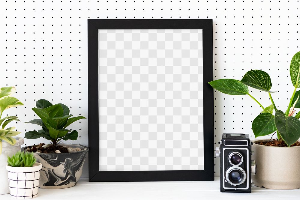 Png picture frame mockup among houseplants home decor