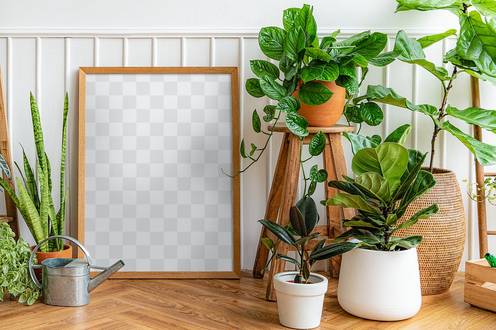 Picture frame mockup transparent png by a houseplant corner on a parquet floor