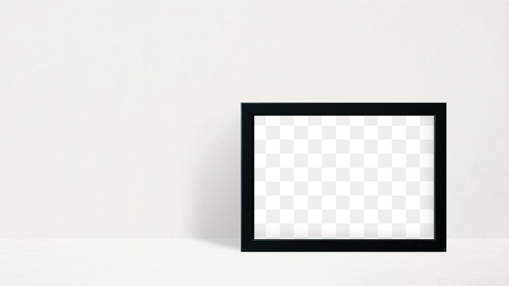 Black picture frame mockup leaning against a white wall