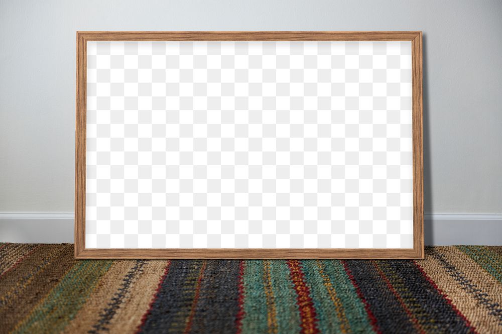 Wooden picture frame mockup leaning against a gray wall