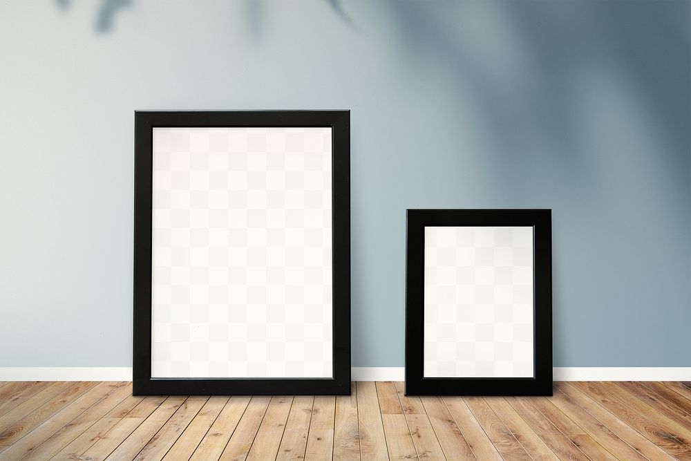 Black picture frame mockups leaning against a gray wall