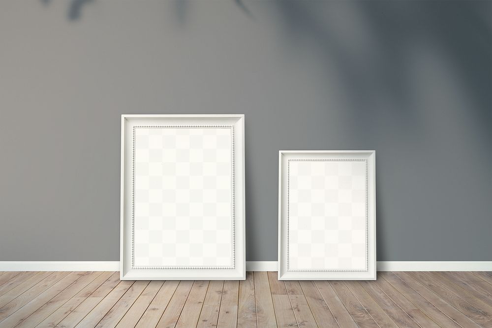 White picture frame mockups leaning against a gray wall