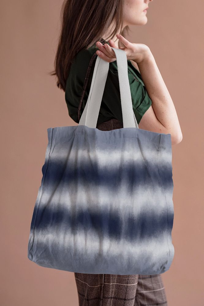 Woman holding tote bag mockup 