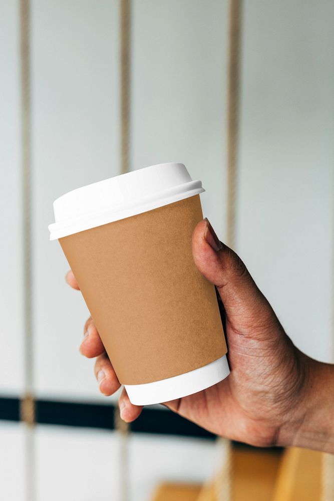 Disposable cup mockup, holding, editable design