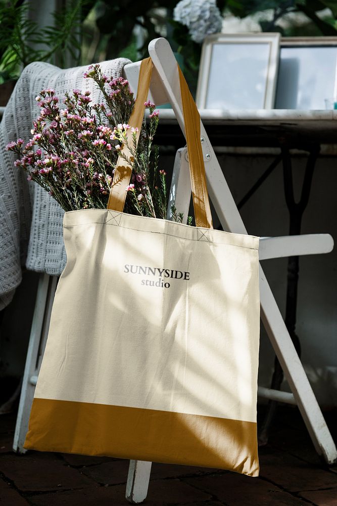 Canvas bag mockup, hanging on outdoor chair