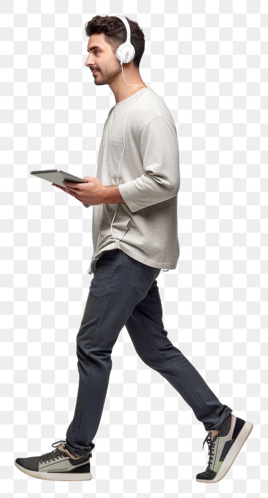 PNG  A younf man holding computer notebook headphones footwear standing. AI generated Image by rawpixel.