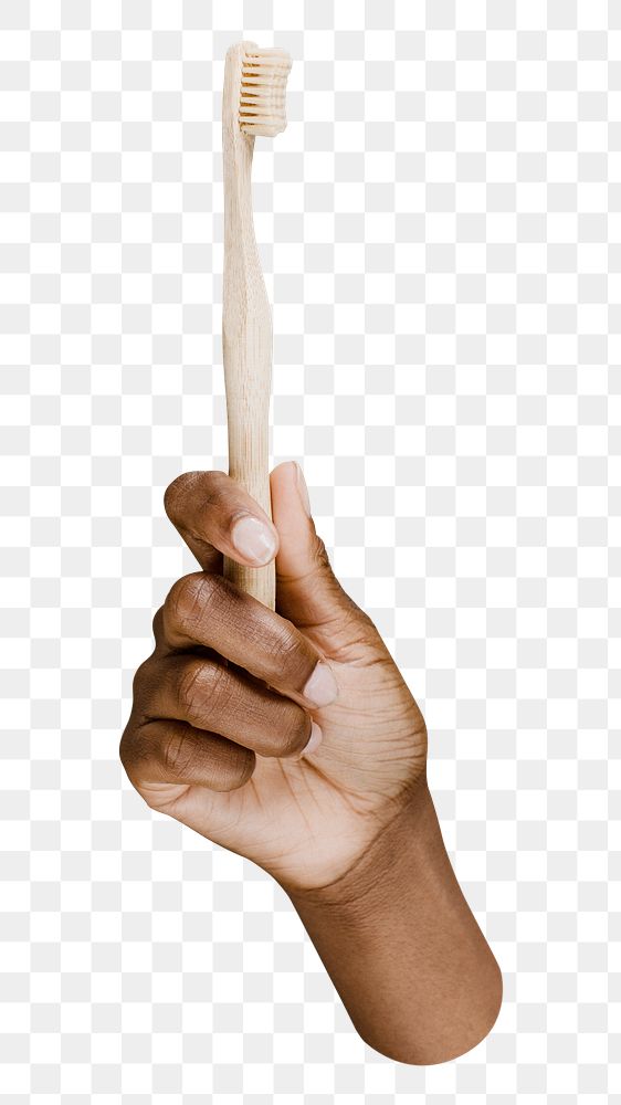 PNG hand holding a wooden toothbrush, collage element, transparent background