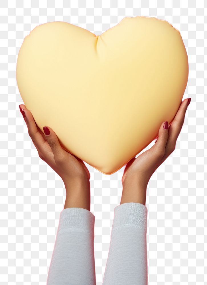 PNG Hand holding big heart pillow yellow pink celebration. AI generated Image by rawpixel.