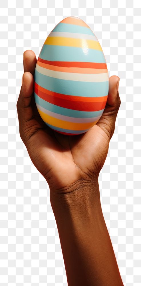 PNG Hand holding a traditional easter egg ball celebration holiday. AI generated Image by rawpixel.