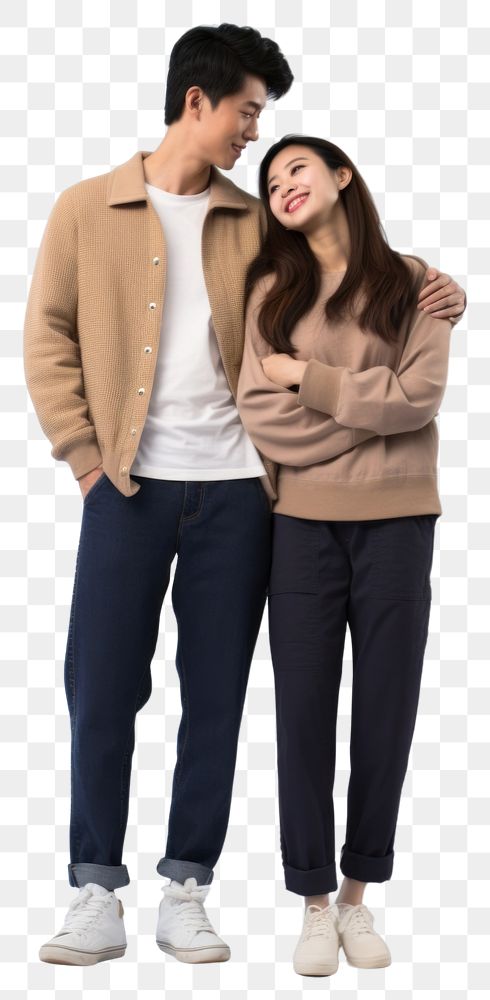 PNG A young asian couple hugging and looking at the camera standing sweater adult. AI generated Image by rawpixel.