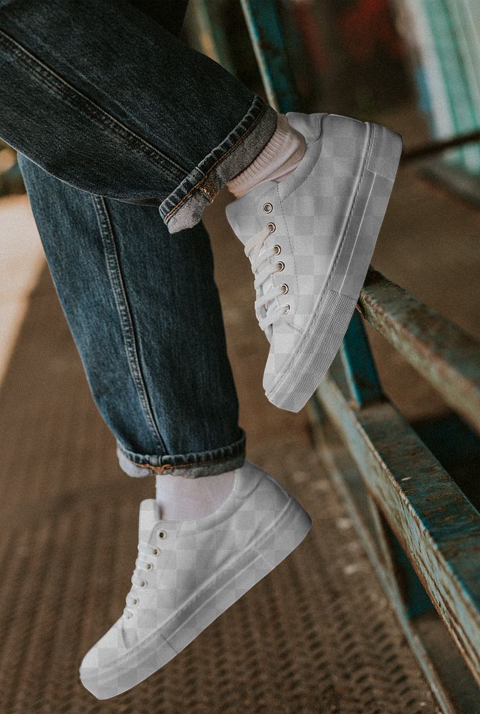 Png white canvas sneakers mockup on jeans model