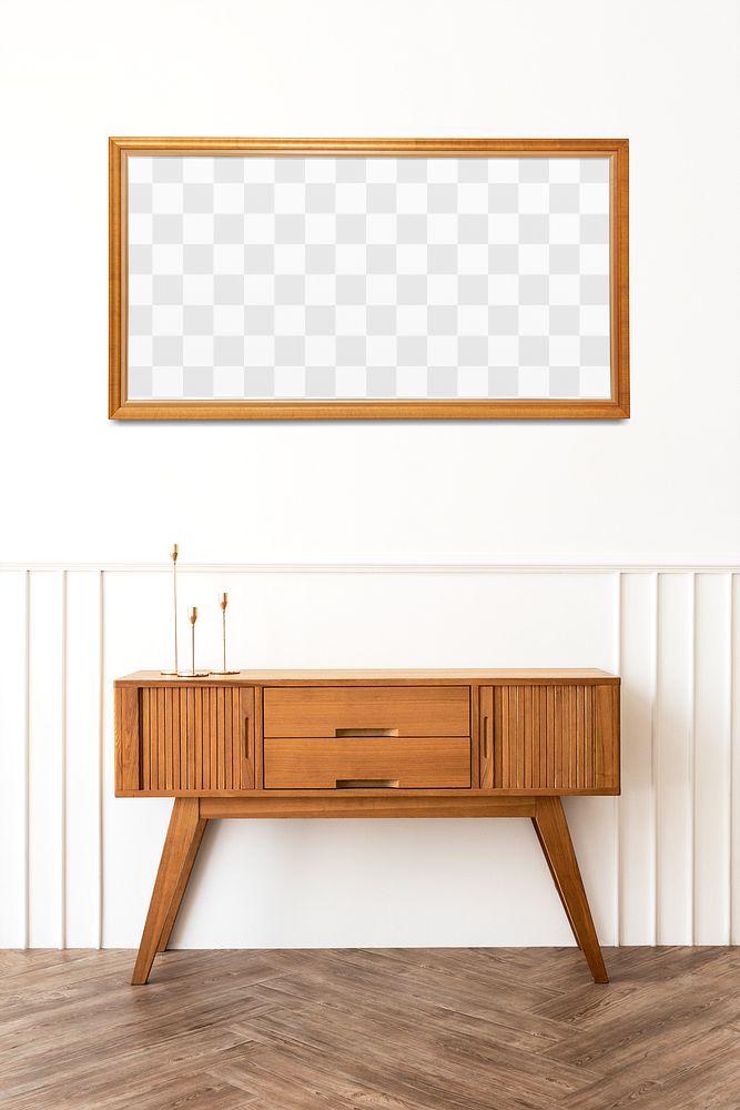Picture frame mockup over a wooden sideboard table with taper candle holders 