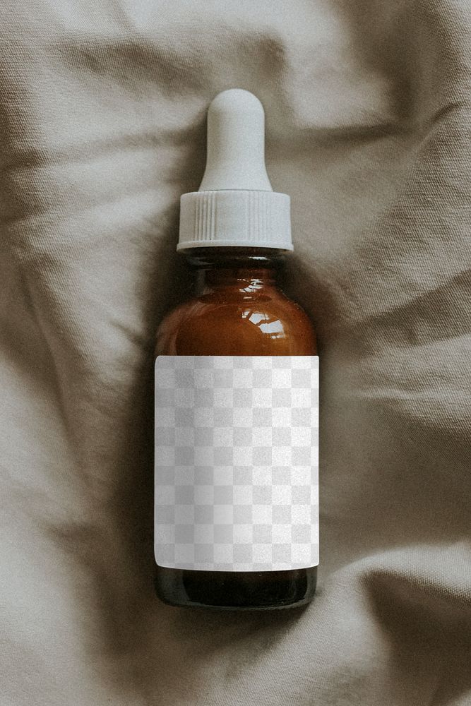 Amber dropper bottle design element on gray fabric background