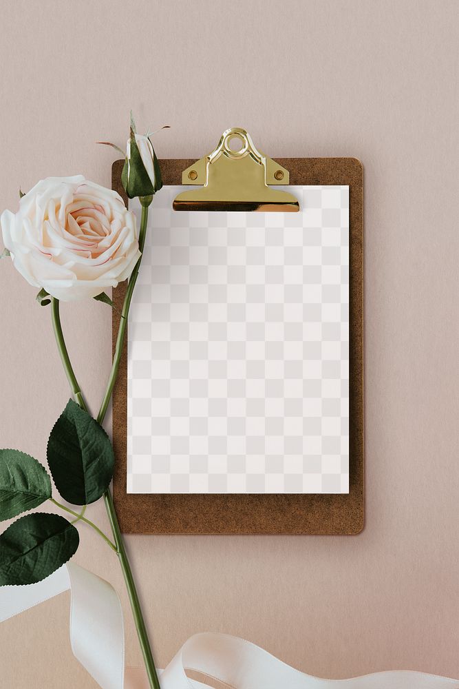 Paper mockup on a cork clipboard with a light pink rose