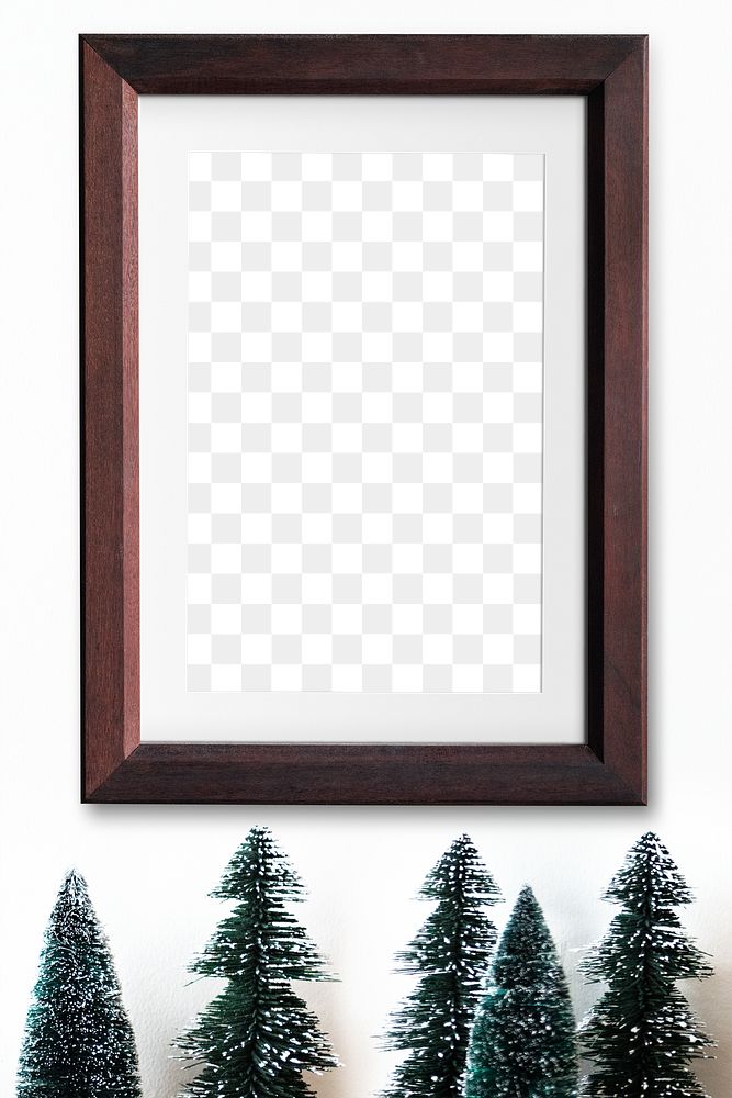 Wooden picture frame mockup by mini Christmas tree decoration 