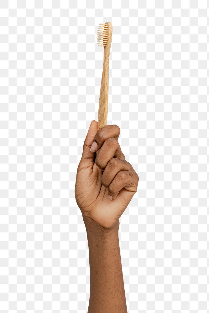 Hand showing a bamboo toothbrush transparent png