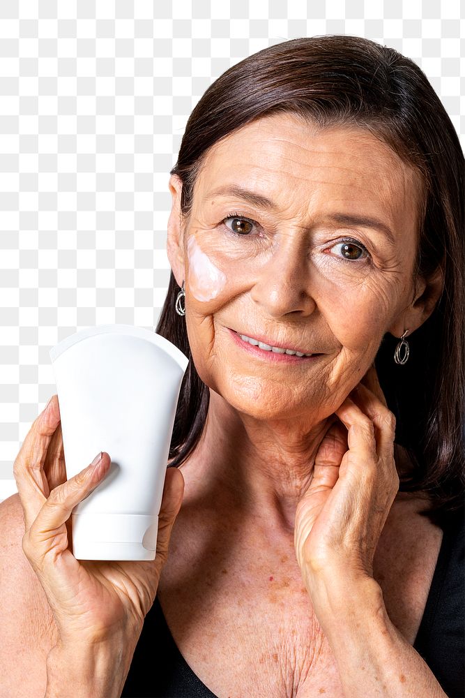 Senior woman holding a white face cream tube transparent png