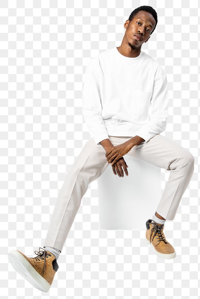 Man png mockup in white sweater and pants sitting on a chair street fashion full body