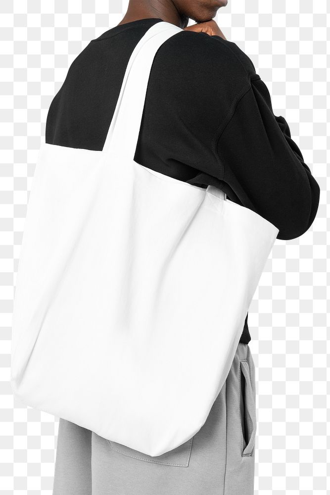 Png man mockup carrying white tote bag